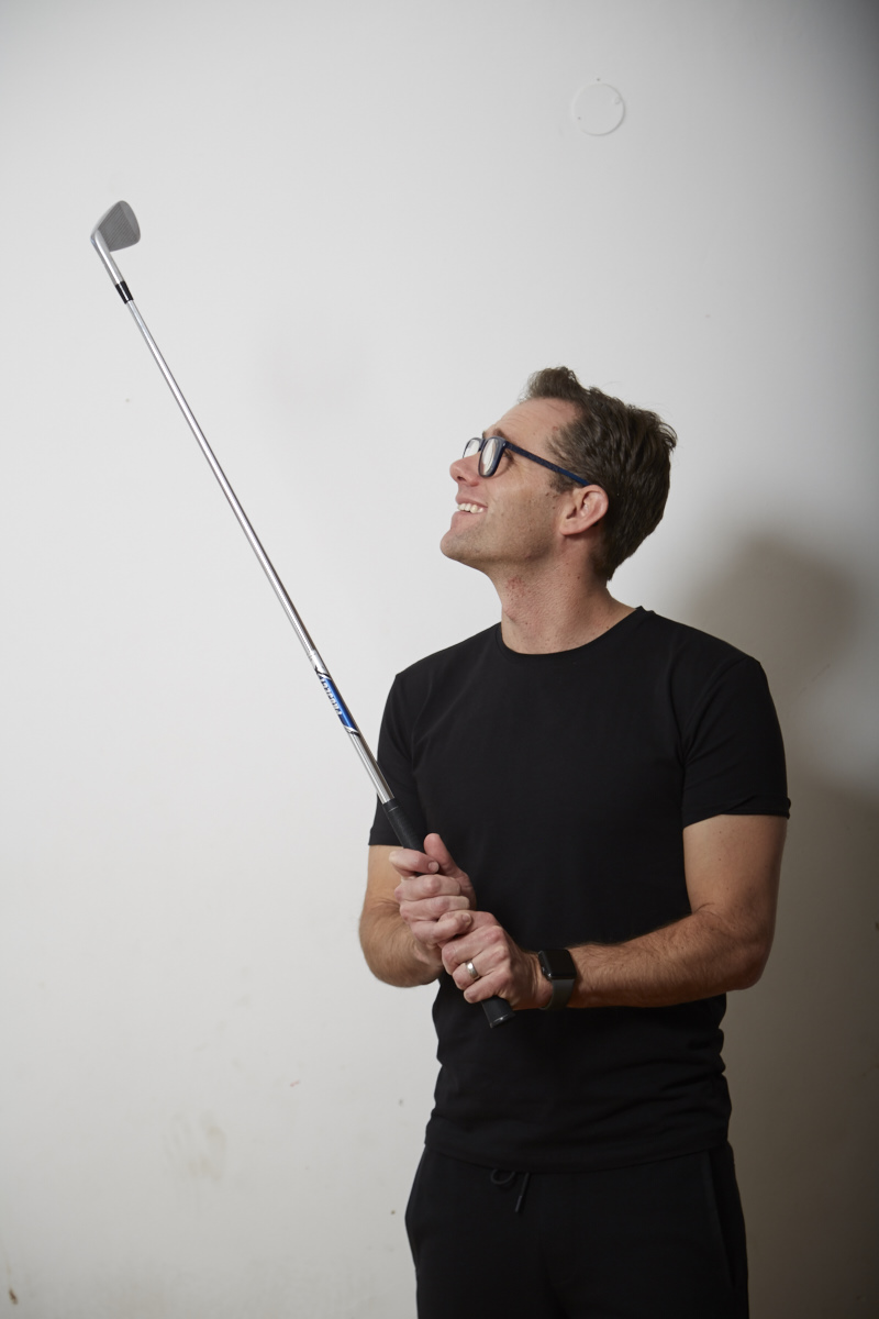 Cameron Venter holding a golf club